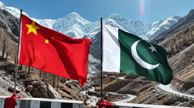 Flags of China and Pakistan in mountainous landscape