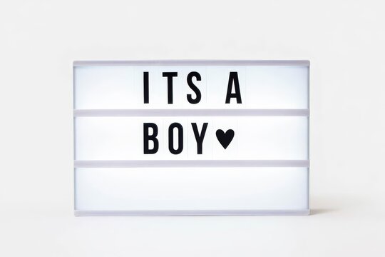 Its a boy text in a light box. Box isolated over white background. A sign with a message.