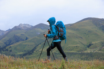 Woman hiking on high altitude mountain top
