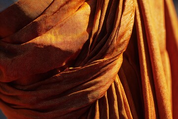 Close-up of a Monk's Robe: Rich Texture and Warm Tones in a Cultural and Religious Context.