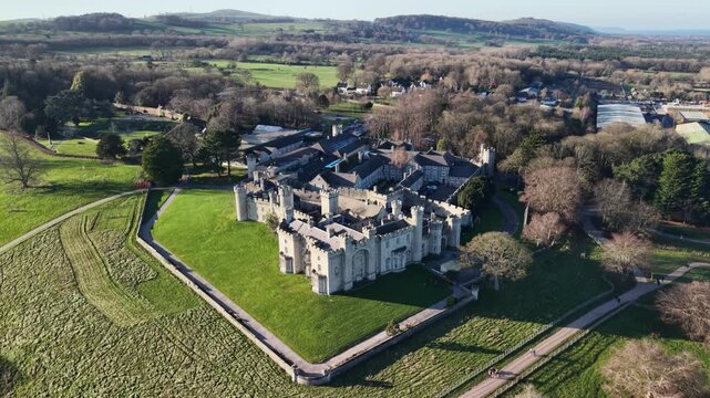Stunning medieval Bodelwyddan Castle very slow drone clockwise rotate from far on a sunny winter day, North Wales, UK