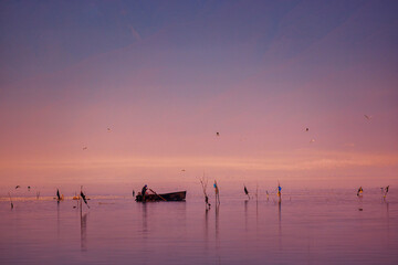 Fisherman at Dawn with Birds &mdash; Kerkini, Northern Greece