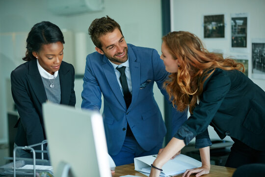 Business people, happy and discussion with team at office with real estate project at company. Group, realtor and agent with documents for planning, insight and review property portfolio at agency