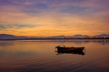 Wooden Boat at Sunset on Calm Lake &mdash; Kerkini, Northern Greece