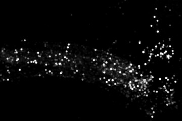 White gray blurred bokeh lights on black background. Glitter sparkle stars for celebrate. Overlay for your design