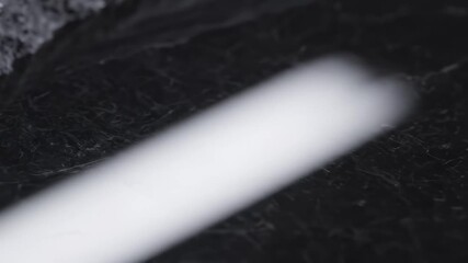 Closeup of a jagged black rock surface