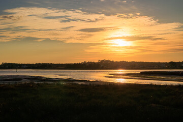 Orange sunset over stone breakwater and Atlantic waves at Furadouro coast Portugal, Ovar &ndash; Furadouro, 12 November 2025