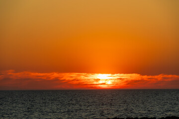 Intense orange sunset above the Atlantic Ocean horizon seen from Furadouro beach Portugal, Ovar &ndash; Furadouro, 11 November 2025