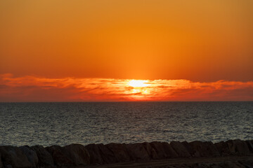 Dramatic orange sunset over the Atlantic Ocean with low clouds at Furadouro coast Portugal, Ovar &ndash; Furadouro, 11 November 2025