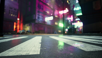 Fototapeta premium A bustling urban street is illuminated with bright neon signs, casting colorful reflections on the wet pavement. The atmosphere feels alive with energy and urban charm during the night.