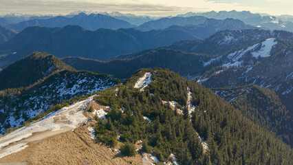 Naklejka premium Chiemgau mountain valley landscape close to the Hochfelln peak during winter and autumn season 