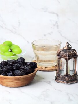 ramadan kareem background with dates, drink, fruit, traditional lantern lamp isolated white background