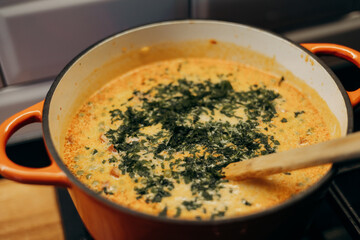 Adding parsley to a dish.