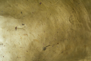 Abstract golden industrial background for design. Left bottom lighting. Copy space.