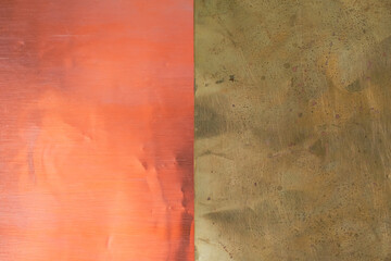 Red Copper and Brass Metal Textures Side by Side. Focus on Brass. Surface of two metal plates for design. Left Light. Copy Space.