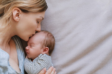 Mother and baby at home. Happy maternity and family.