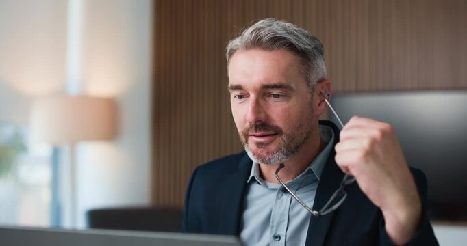 Businessman, glasses and thinking in office with laptop, financial proposal or investment opportunity. Mature person, eyewear or reflection with computer for finance report, capital funding or email.