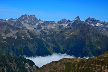 Austrian Alps - view from the top of Greitspitze to the clouds in the Paznaun Valley