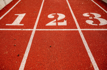 Red running track in stadium. Sport recreation