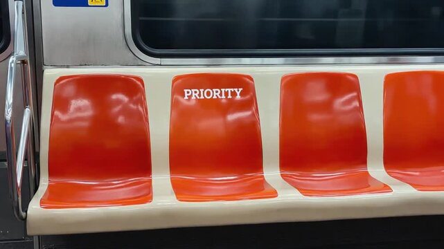 Priority sign on the subway seat. Priority seat.