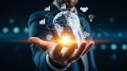 Global business strategy and digital transformation concept. Businessman holding a glowing holographic Earth surrounded by icons for data analytics, innovation, partnership, and goals in a futuristic 