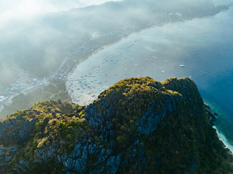 aerial view of El Nido, Philippines, featuring emerald lagoons, limestone karst islands, and vibrant tropical waters