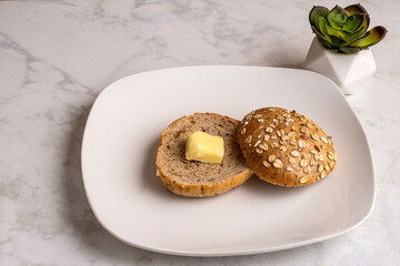 multi grain bagel  with a slice of butter