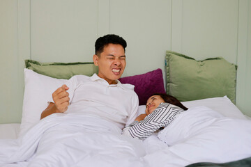 Woman and man waking up in the morning.