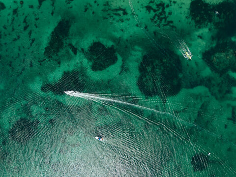 Breathtaking aerial view of Boracay, Philippines, featuring emerald lagoons, limestone karst islands, and vibrant tropical waters