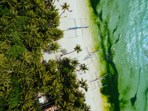 Breathtaking aerial view of Boracay, Philippines, featuring emerald lagoons, limestone karst islands, and vibrant tropical waters