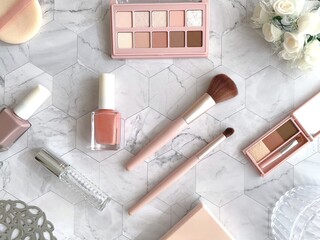 Beauty makeup tools and cosmetics flat lay in soft pink tones