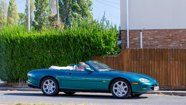 Bletchley,Bucks,UK - Aug 25th 2025:  1997 Jaguar xk8 classic  car driving on a British road
