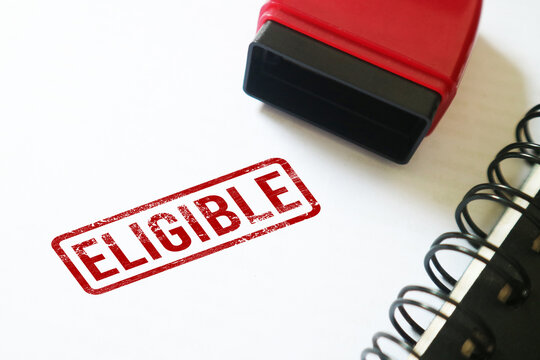 Eligible Red stamp on a white paper notebook