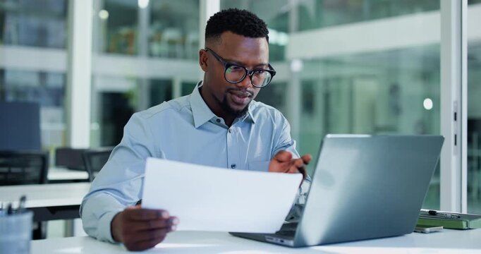 Laptop, typing or black man with paper in office, income statement audit or check accounting compliance. Reading, report accuracy or employee with finance review, bookkeeping or change mistake on pc