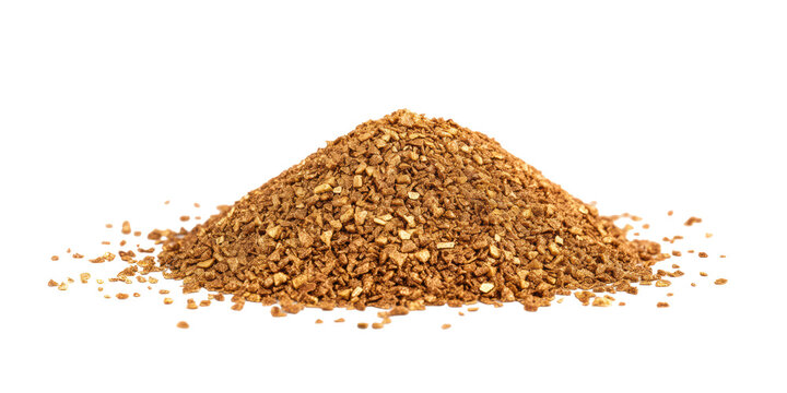 A Detailed Macro Photograph of a Pile of Brown Freeze Dried Instant Coffee Granules or Granulated Chicory on a Transparent Background.