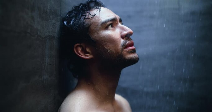 Mental health, sadness and man in shower with reflection, anxiety trigger or memory of past trauma. Grief, flashback and male person in bathroom with thinking, loss or fatigue in emotional thoughts.