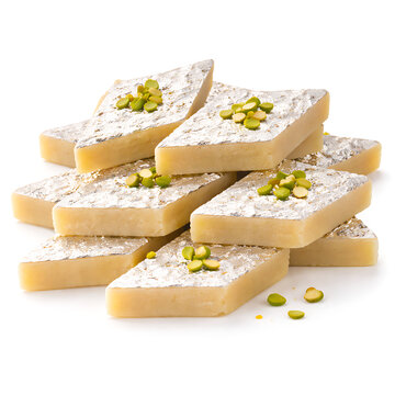 Kaju Katli diamond-shaped cashew fudge, silver leaf detail, white background