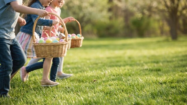 Kids run outdoor on grass during an Easter egg hunt with baskets full of colorful eggs. Spring holiday celebration activity for children