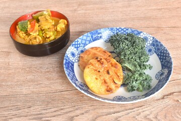spicy boiled slice pork eggplant in curry soup eat couple grilled sticky rice with egg and curly kale vegetable on plate