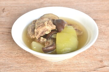 boiled winter melon with pork bone and black mushroom soup on bowl