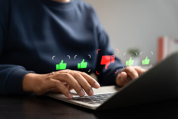 User negative online review on laptop with thumbs down icon,representing customer dissatisfaction,bad feedback,low rating,service criticism,negative impact on digital reputation,online business trust.