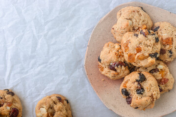 freshly baked fruitcake cookies on earthenware plate