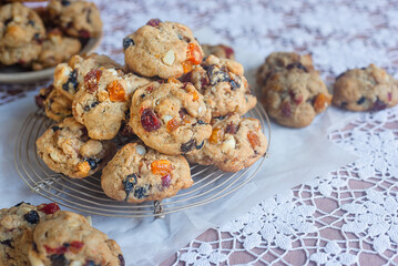 freshly baked fruitcake cookies on cooling rack.
