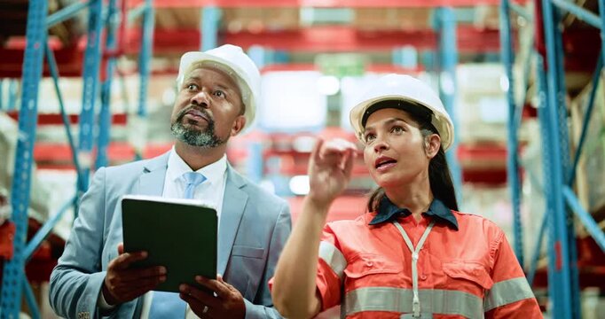 Man, woman and tablet with team discussion at warehouse, logistics or point for shipping solution. People, inspection and talk with tech, application or storage for supply chain at distribution plant