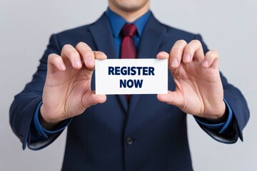 Man showing paper with REGISTER NOW text.
