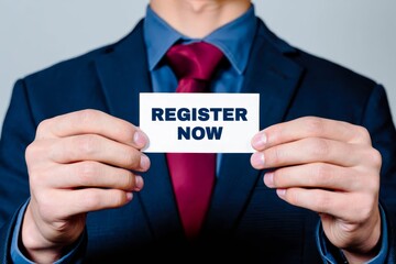 Man showing paper with REGISTER NOW text.