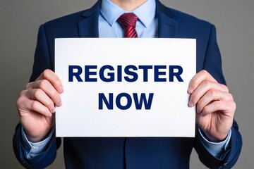 Man showing paper with REGISTER NOW text.