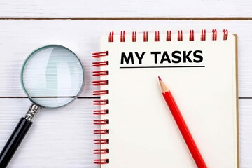 MY TASKS text on notebook on a white wooden background , business concept.