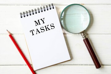 MY TASKS text on notebook on a white wooden background , business concept.