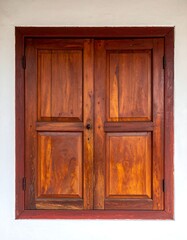 Rustic Wooden Window with Intricate Frame Details.
